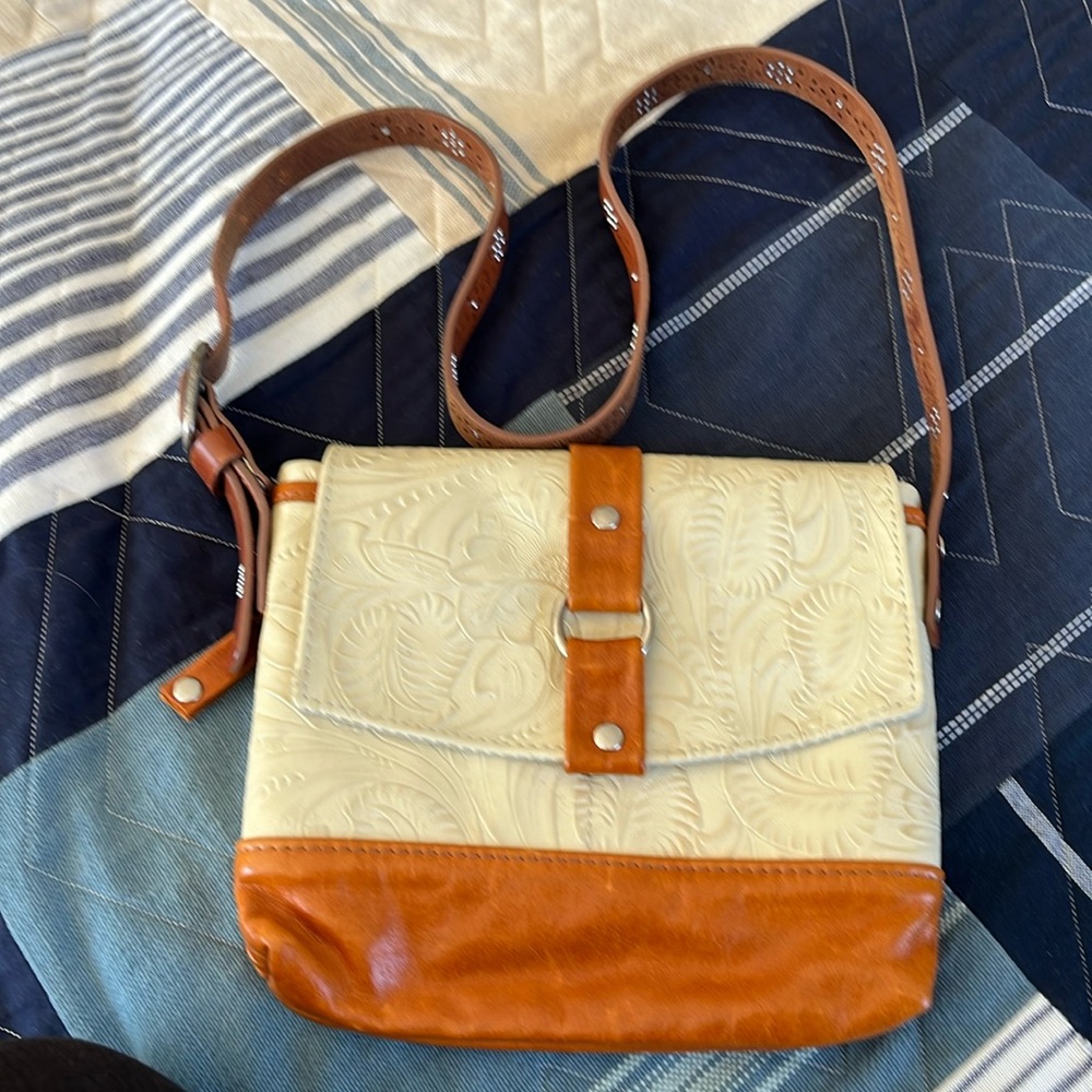 Tan and camel tooled leather bag